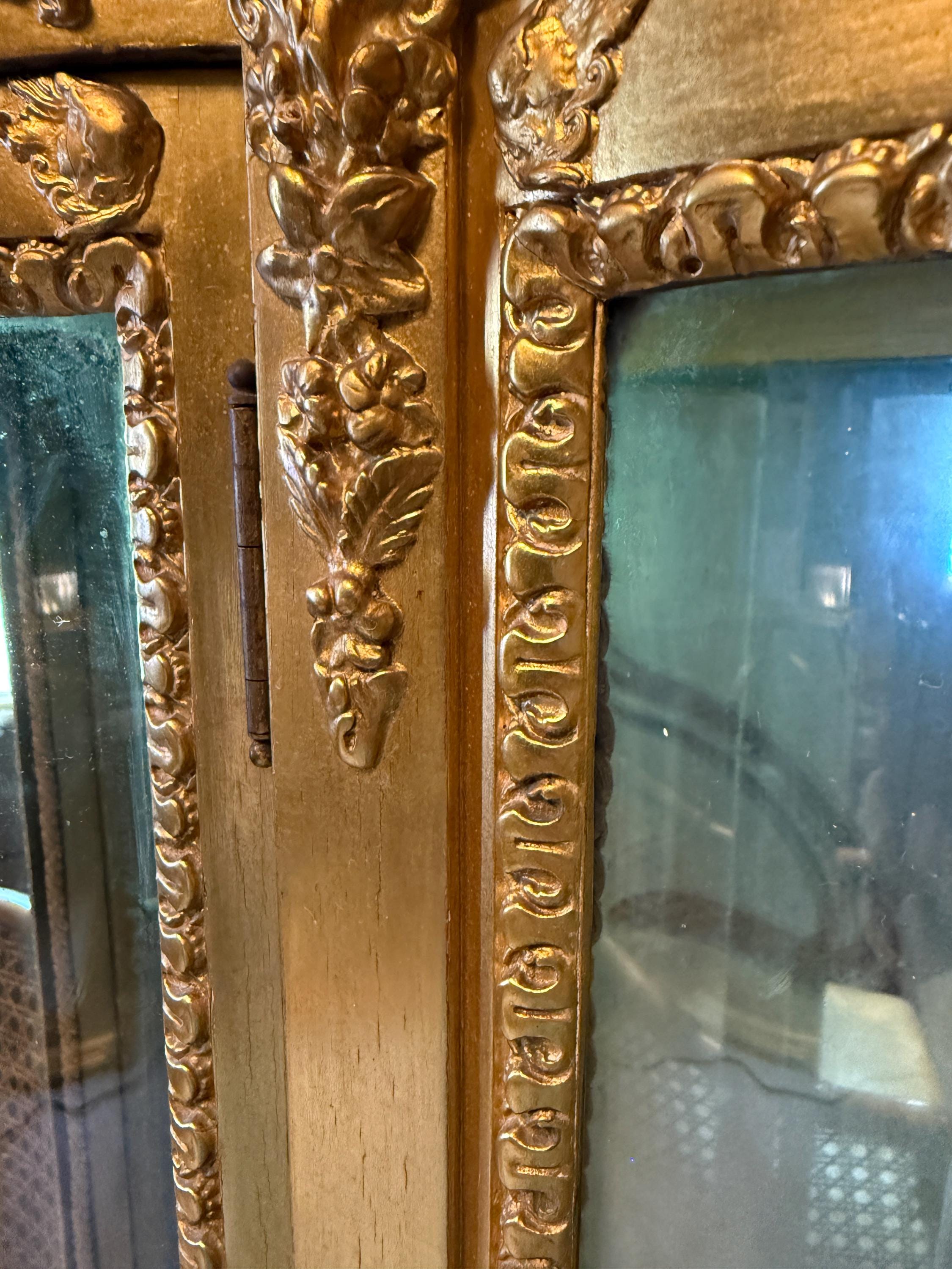 Victorian Wood Gilded Glass Display Cabinet Curved Glass Antique Showcase Shelves Gold Trimmed Curio Cherub Home Decor Elegant Accent Piece