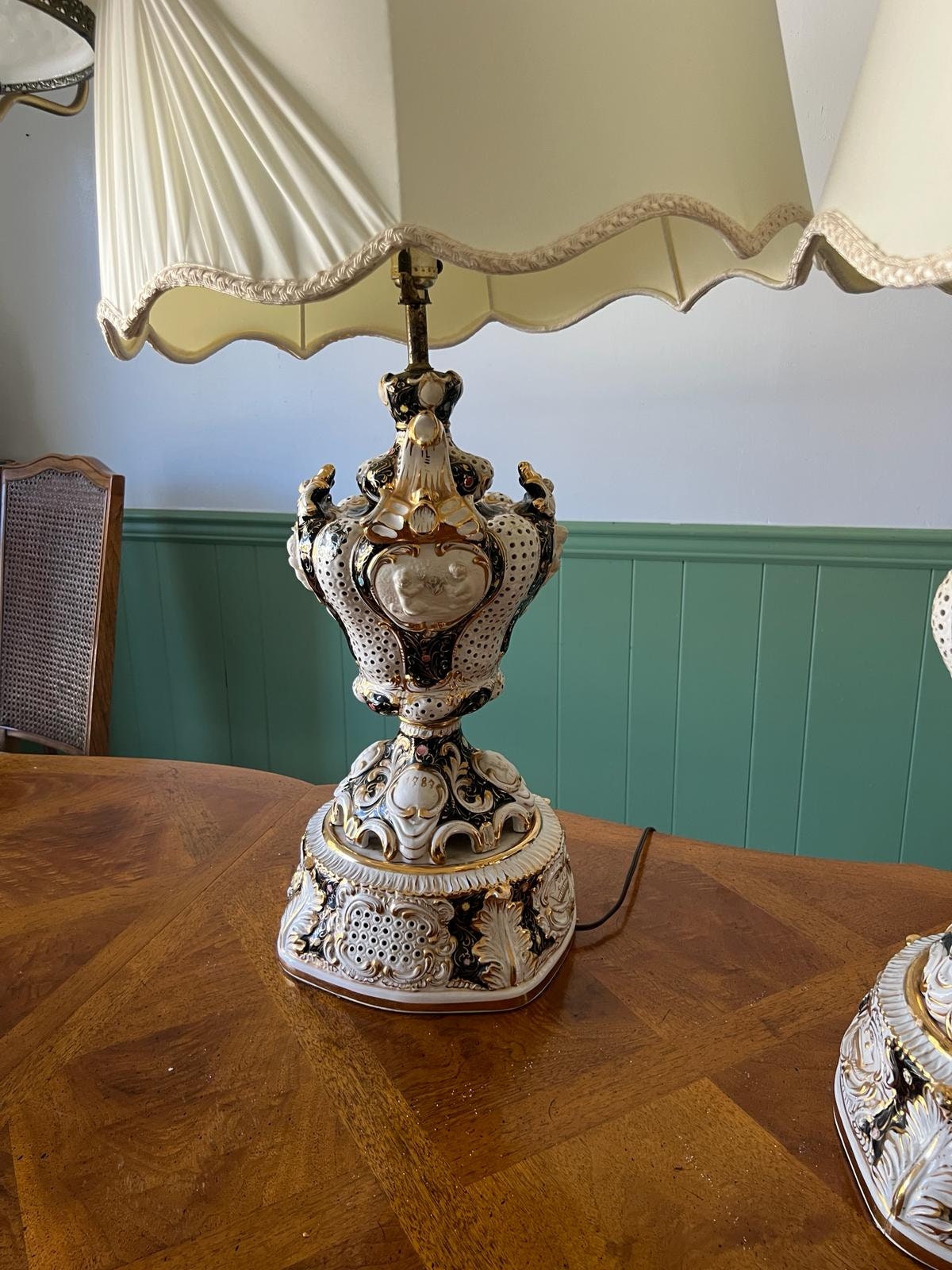 Baroque Porcelain Table Lamps Pair Ornate Cherub Motif Black White Gold Embellished Romantic Rococo Style Sculptural Lighting Decoration