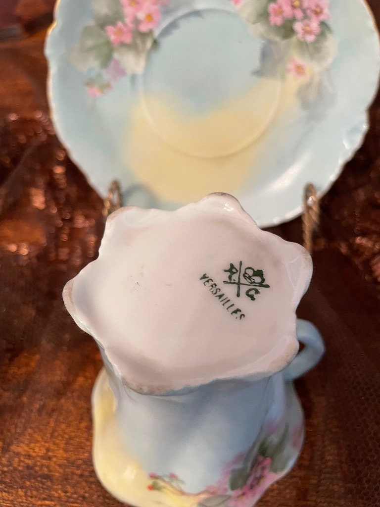 Antique Versailles Demitasse Cup Saucer Set Hand Painted Pink Blossoms Scalloped Edges Pastel Blue Gold Rim Vintage Porcelain Collectible