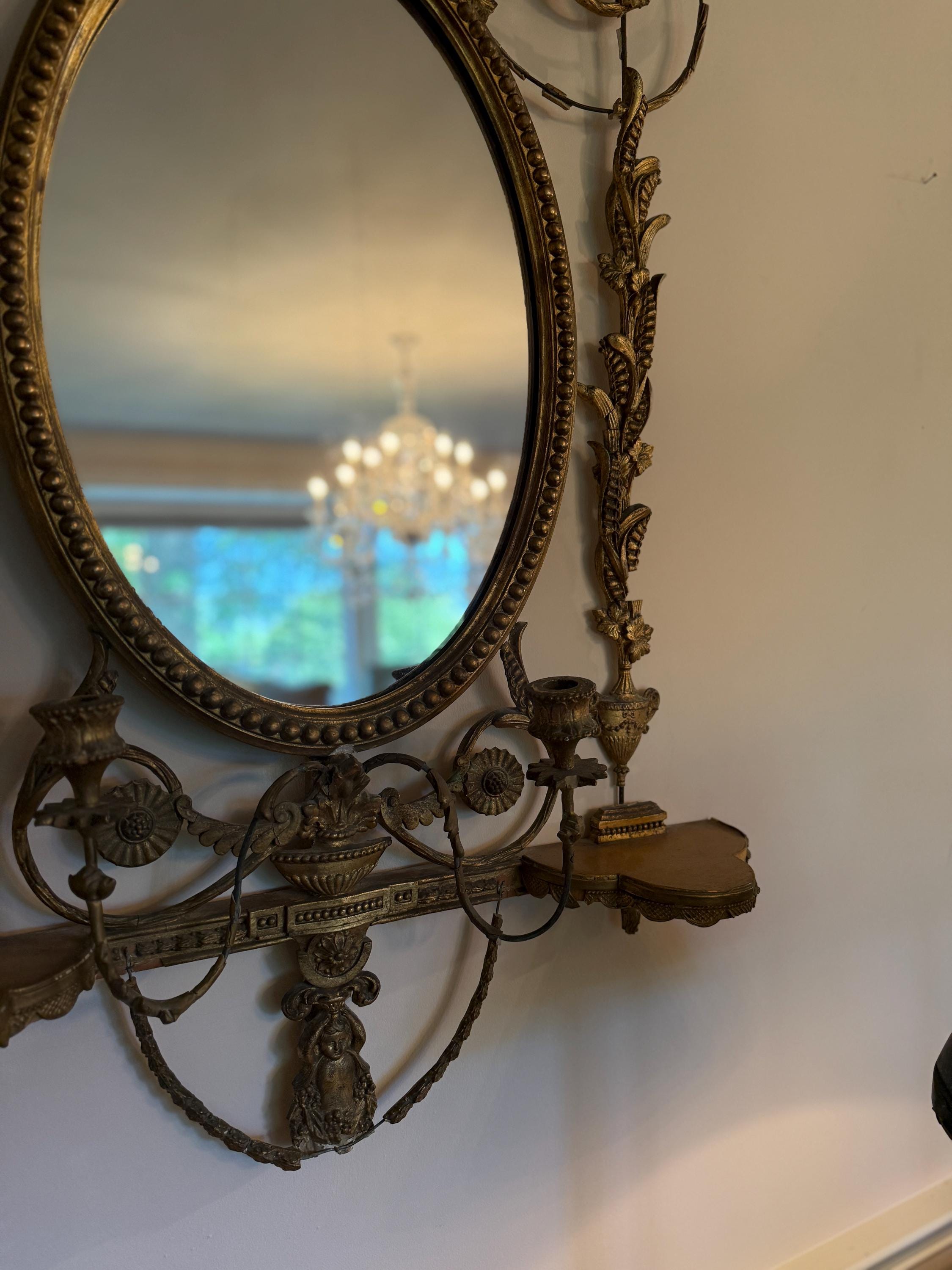 Antique French Wall Mirror 19th Century Oval Gilt Floral Wood Neoclassical Design Urn Garland Carvings Two Candle Shelves Luxurious Mirror