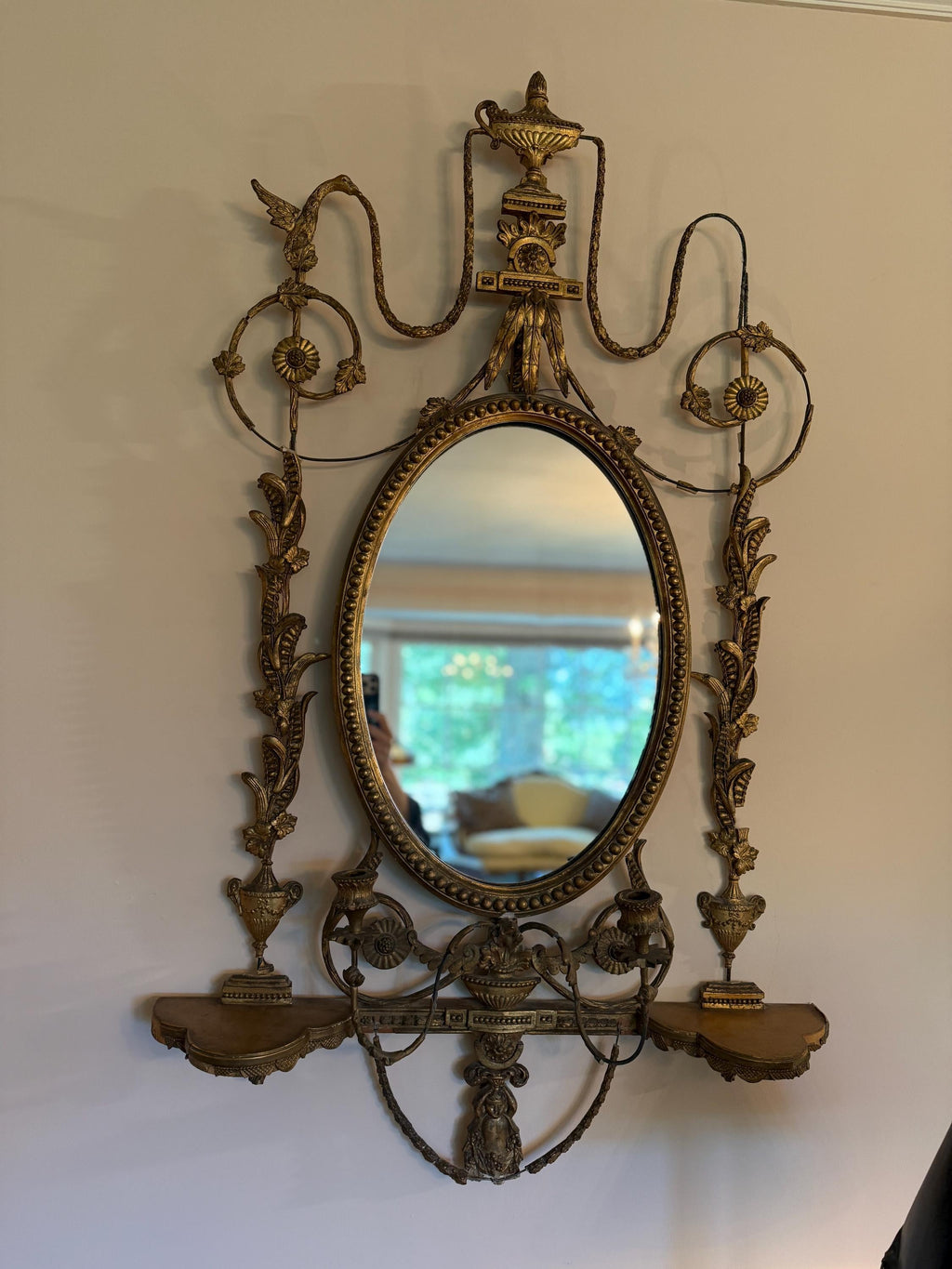 Antique French Wall Mirror 19th Century Oval Gilt Floral Wood Neoclassical Design Urn Garland Carvings Two Candle Shelves Luxurious Mirror