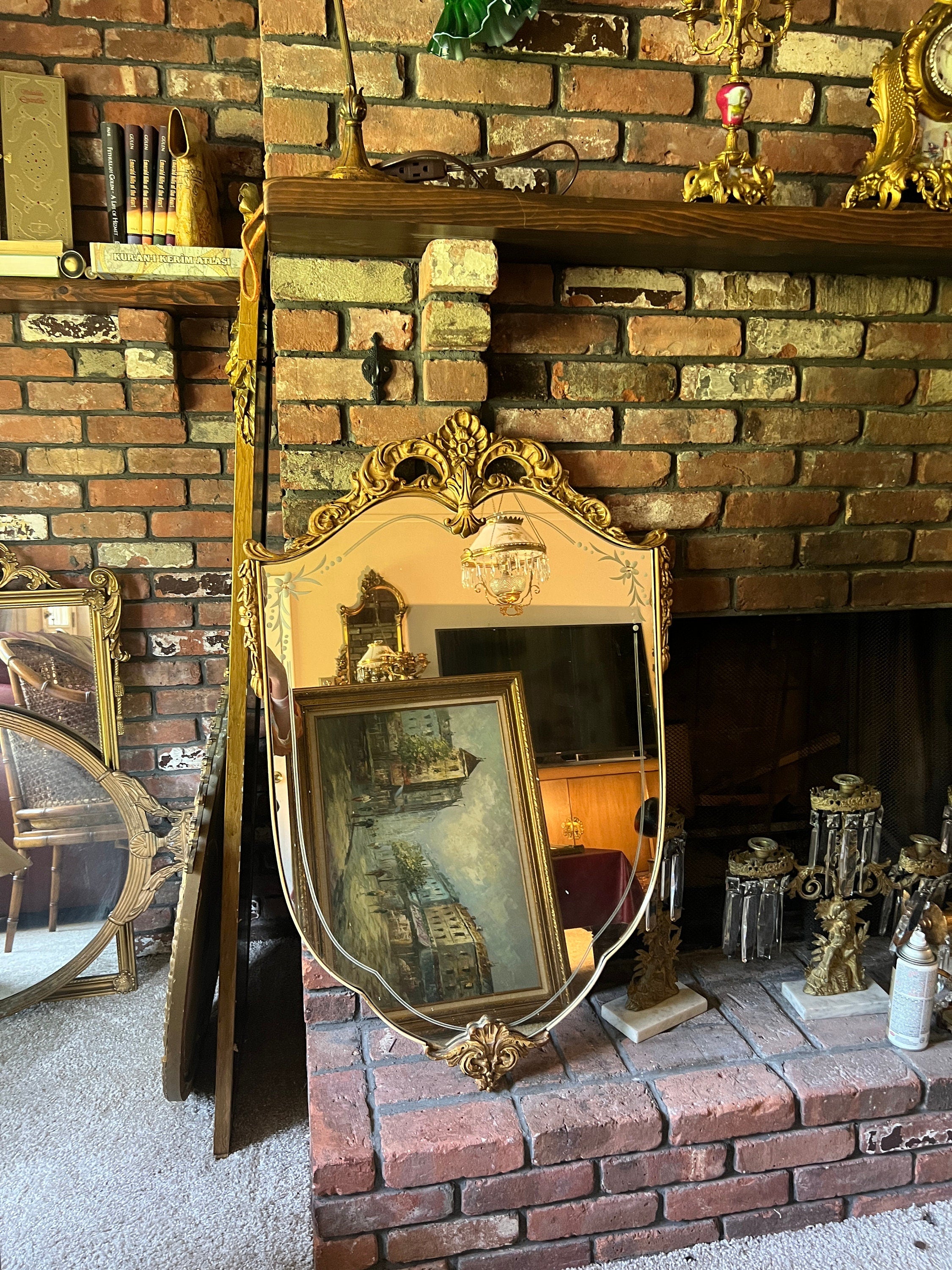 Antique Rococo Mirror Gold Gilt Shield Shape Ornate Carved Frame Beveled Glass Floral Detail Wall Decor French Vintage Statement Piece